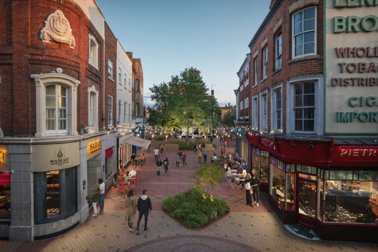Artist's impression of Market Place at dusk as a traffic-free street: brick paving, café tables outside the shops, festoon lights, trees and a raised planting bed, with people walking through.