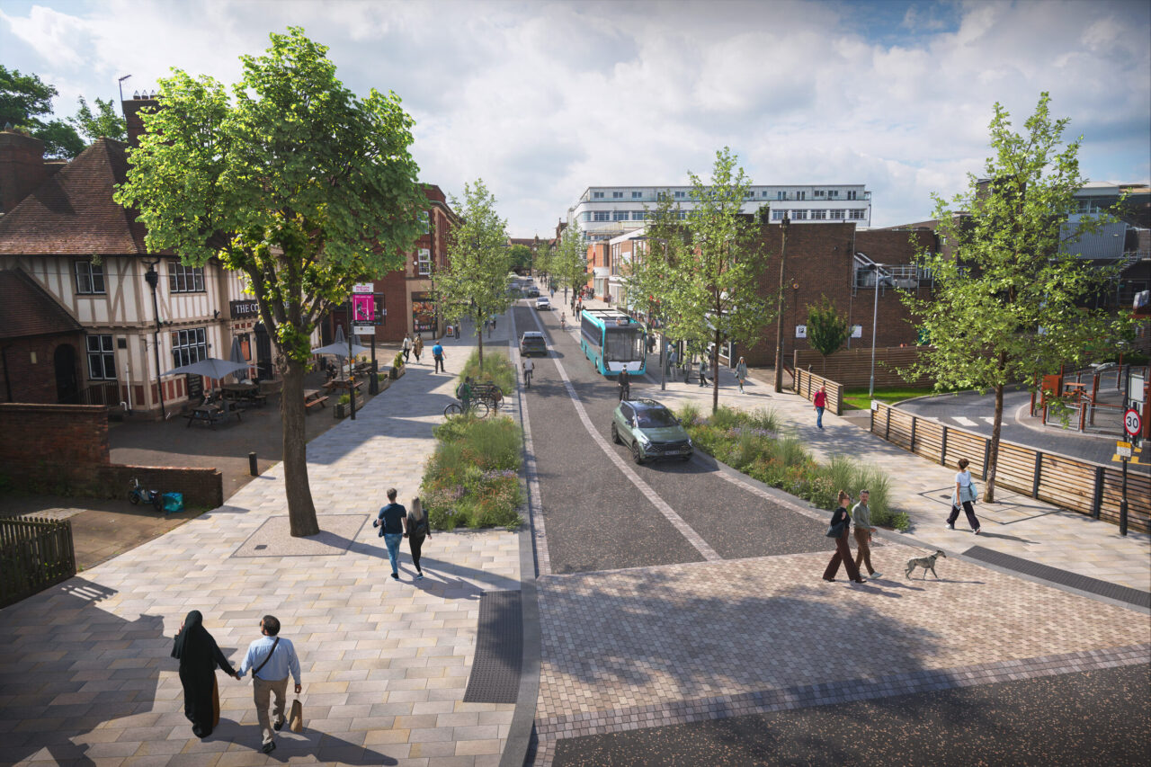Artist's impression of a tree-lined street with a bus, wide paved footways, a planted verge between the road and the cycle route, and people crossing at a raised table.