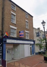 The empty former TSB building on Sheep Street, a three-storey brick building with a blue shopfront.