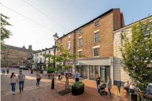 How Sheep Street could look, with people walking past the refurbished building.