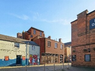 How Drury Lane could look, with brick buildings and street art.