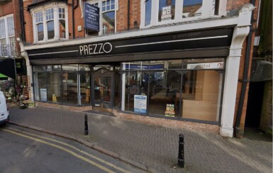 The former Prezzo restaurant with a dark shopfront and closed frontage.