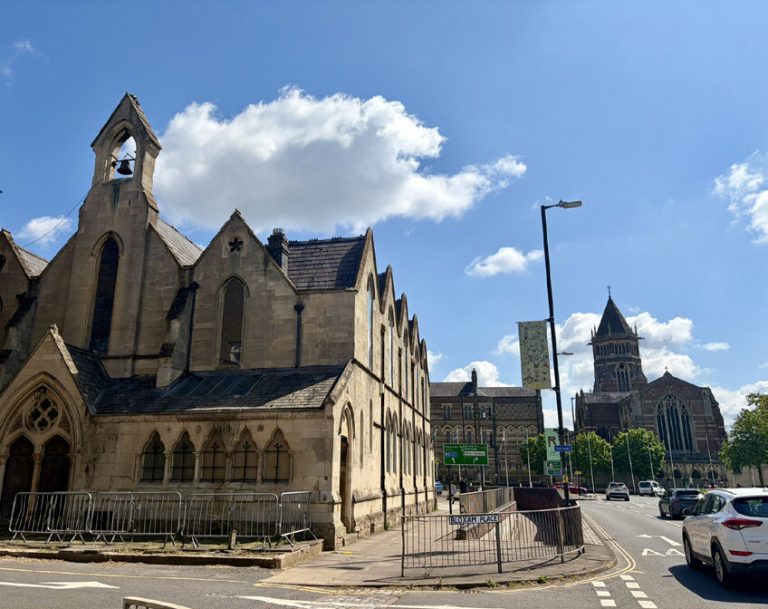 St Matthew's Church beside the gyratory road, with Rugby School buildings beyond.